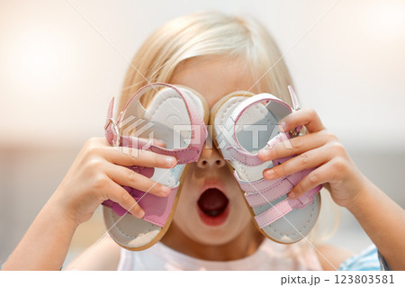 Girl child shopping for shoes, wow discount price in retail store and funny crazy face. Excited, young kid in boutique toddler sale, future footwear designer holding sandals and pink surprise gift Girl child shopping for shoes, wow discount price in retail store and funny crazy face. Excited, young kid in boutique toddler sale, future footwear designer holding sandals and pink surprise gift 123803581