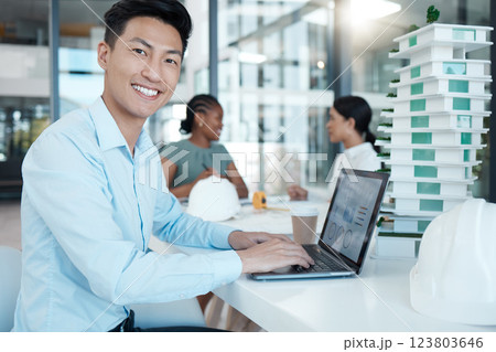 Architect, man with laptop and architecture business, planning strategy and engineering data. Young Asian working, diversity and design model, corporate conference room and smile in portrait. 123803646