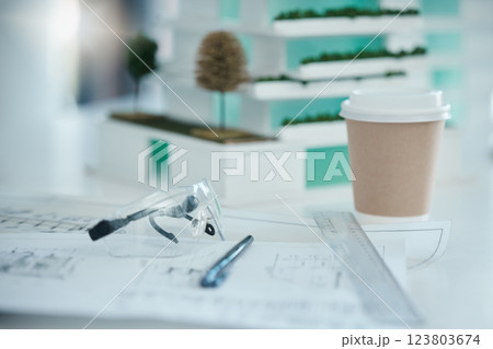 Architecture, planning and design on desk with drawing tools, safety glasses and coffee. Blueprint, vision and idea for architect, engineer or construction worker in building or construction industry 123803674