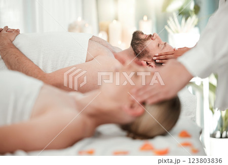Relax, spa and couple head massage on table bed in luxury hotel, hospitality or salon scalp messaging. Reiki, wellness or acupressure therapy for headache or stress relief of man and woman together. Relax, spa and couple head massage on table bed in luxury hotel, hospitality or salon scalp messaging. Reiki, wellness or acupressure therapy for headache or stress relief of man and woman together. 123803836
