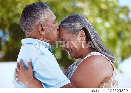 Elderly, couple and happy with love, hug and kiss on face in backyard, garden or park together in summer. Man, woman and retirement show romance, bonding and care in nature, smile and embrace Elderly, couple and happy with love, hug and kiss on face in backyard, garden or park together in summer. Man, woman and retirement show romance, bonding and care in nature, smile and embrace 123803839