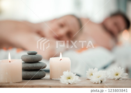 Background of aromatherapy candles, spa and couple luxury skincare, zen wellness and relax body at vacation salon. Closeup of massage stones, calm space and holistic beauty service for stress relief 123803841