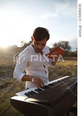 Piano Tuning Tool Used By Man Close Up Piano Tuning Tool Used By Man Close Up 123806838