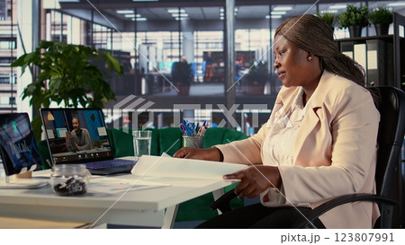 Empowered woman director participates in a global business conference, showcasing her leadership, networking skills and commitment to staying ahead of industry trends. Investors group. Camera B. Empowered woman director participates in a global business conference, showcasing her leadership, networking skills and commitment to staying ahead of industry trends. Investors group. Camera B. 123807991