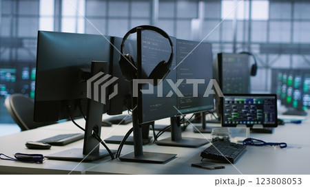 Artificial intelligence applications used in data center workplace to maintain company network equipment, handheld camera shot. AI programs used in server room to ensure optimal system performance 123808053