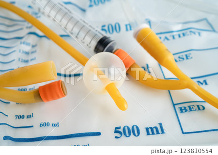 Foley catheter and urine drainage bag collect urine for disability or patient in hospital. 123810554