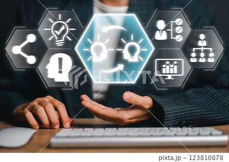 Visual representation of knowledge transfer using digital icons and human interaction, symbolizing innovation and learning. Visual representation of knowledge transfer using digital icons and human interaction, symbolizing innovation and learning. 123810878