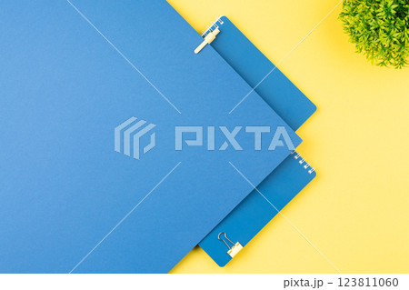 Spiral notepad with stationery on office table. Spiral notepad with stationery on office table. 123811060