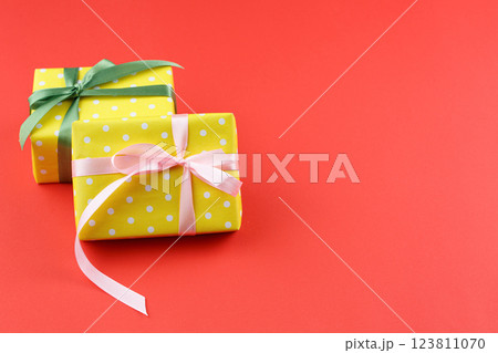 Present in gift paper on the table. 123811070