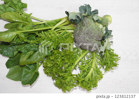 Homegrown organic vegetables isolated on white wood background. wasabina,spinach,bloccoli. 123812137