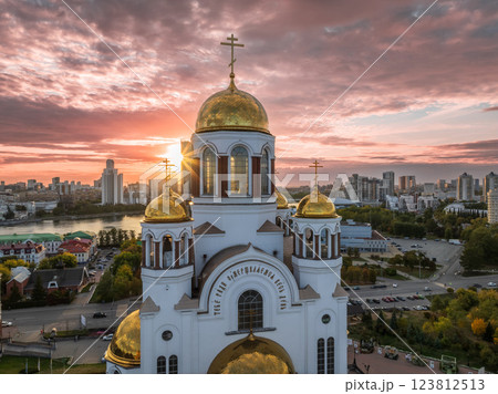 Autumn Yekaterinburg and Temple on Blood in beautiful clear sunset. Aerial view of Yekaterinburg, Russia. Translation of the text on the temple: Honest to the Lord is the death of His saints. Autumn Yekaterinburg and Temple on Blood in beautiful clear sunset. Aerial view of Yekaterinburg, Russia. Translation of the text on the temple: Honest to the Lord is the death of His saints. 123812513