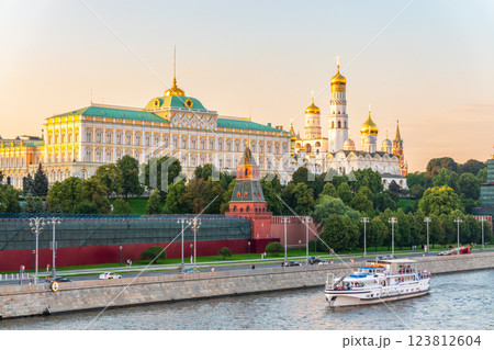 View of Kremlin with Vodovzvodnaya tower, Grand Kremlin Palace from repaired Bolshoy Kamenny Bridge in Moscow city on sunny summer day. Cruise ship sails on the Moscow river View of Kremlin with Vodovzvodnaya tower, Grand Kremlin Palace from repaired Bolshoy Kamenny Bridge in Moscow city on sunny summer day. Cruise ship sails on the Moscow river 123812604