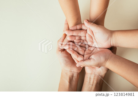 Family Day concept, Parents and kid hold empty hands top view isolated. Portraying togetherness support and generational legacy. 123814981