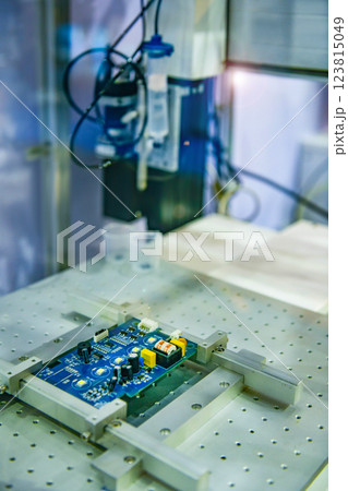 Automatic robots for assembling electronic circuit boards in factories 123815049