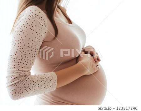 Pregnant woman gently holding her belly in serene pose. ai generative 123817240