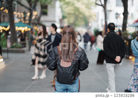 woman traveler visiting in Shanghai, China. Female Tourist with backpack sightseeing in Xintiandi. landmark and popular for tourism attractions in Shanghai. Travel and vacation concept woman traveler visiting in Shanghai, China. Female Tourist with backpack sightseeing in Xintiandi. landmark and popular for tourism attractions in Shanghai. Travel and vacation concept 123818286