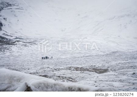 Group of people relaxing on the huge glacier field, Pamir Mountains, Kyrgyzstan Group of people relaxing on the huge glacier field, Pamir Mountains, Kyrgyzstan 123820274