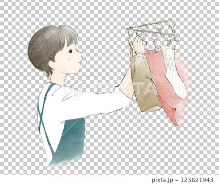 A woman hanging up the laundry A woman hanging up the laundry 123821943