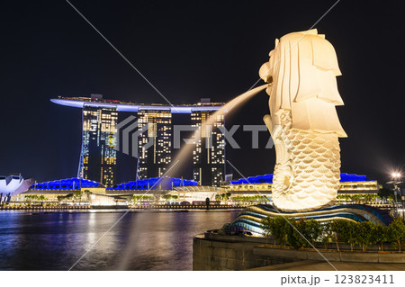 Night view of the Merlion with the background of Marina Bay Sands buildings in Singapore. Merlion is the official mascot of Singapore. Night view of the Merlion with the background of Marina Bay Sands buildings in Singapore. Merlion is the official mascot of Singapore. 123823411