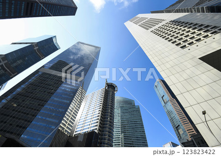 Low-angle building view of the modern office skyscrapers in the financial district of Raffles Place, Singapore. Low-angle building view of the modern office skyscrapers in the financial district of Raffles Place, Singapore. 123823422