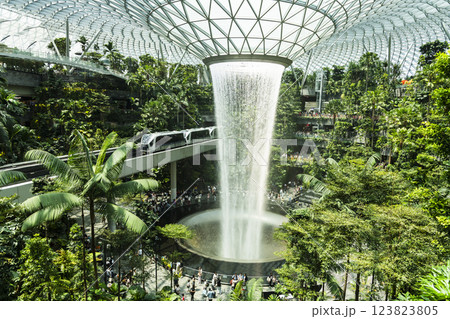 View of HSBC Rain Vortex at Jewel Changi Airport, Singapore, is the world's largest and tallest indoor artificial waterfall and surrounded by a terraced forest setting. 123823805