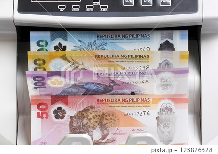 Philippine peso in the counting machine 123826328
