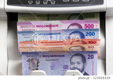 Mozambican metical in the counting machine 123826329