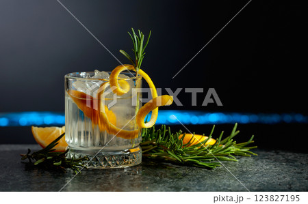 Refreshing gin-tonic cocktail with lemon and rosemary. 123827195