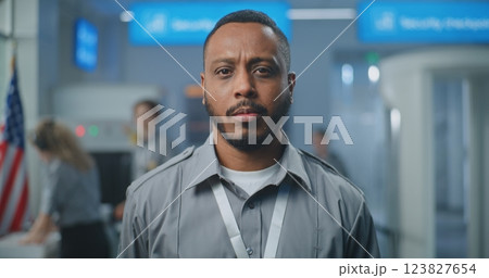 Airport Security Checkpoint: Portrait of Security Officer in Uniform Looking at Camera 123827654