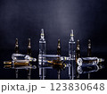 Ampoules with medicine on glossy black background 123830648