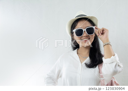 closeup, Young Asian woman wearing straw hat with excited expression and sunglasses running summer vacation, travel advertising studio shoot closeup, Young Asian woman wearing straw hat with excited expression and sunglasses running summer vacation, travel advertising studio shoot 123830904