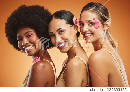 Beauty, skincare and diversity with a model woman group in studio on an orange background for health or inclusion. Wellness, makeup and face with a portrait of female friends posing for empowerment Beauty, skincare and diversity with a model woman group in studio on an orange background for health or inclusion. Wellness, makeup and face with a portrait of female friends posing for empowerment 123833155