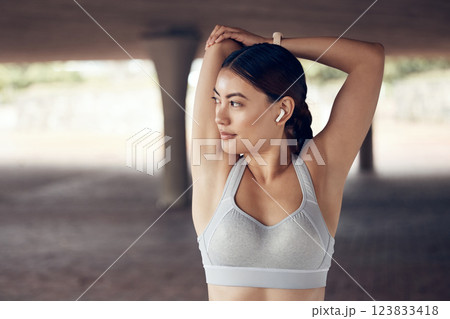 Sports, training and fitness by woman stretching for exercise with earphone, muscle wellness health warm up. Music, motivation and girl with strong focus and mindset, start and body cardio workout 123833418