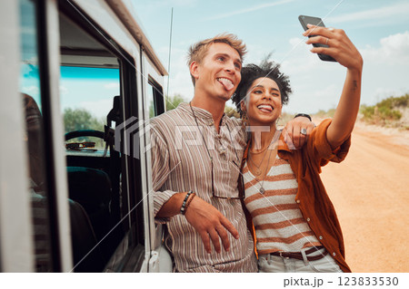 Road trip, travel and selfie couple with smartphone and van in desert for outdoor adventure with social media post update. Love, gen z and influencer people in cellphone portrait for nature journey 123833530