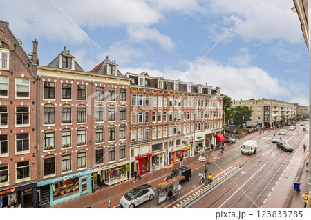 A vibrant urban landscape showcasing traditional architecture aligned along a busy street, capturing the essence of city life. 123833785