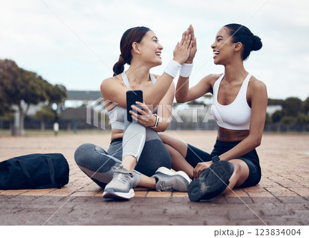 High five, success and fitness friends with goals, motivation and winning mindset in celebration of targets. Sports, teamwork and happy women celebrate running workout, exercise and cardio progress 123834004