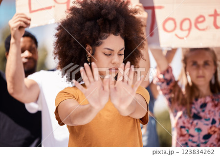 Protest, stop and hands of black woman with people in street for equality, freedom and human rights. Justice, community and group of activist on road in city for black lives matter and social change 123834262