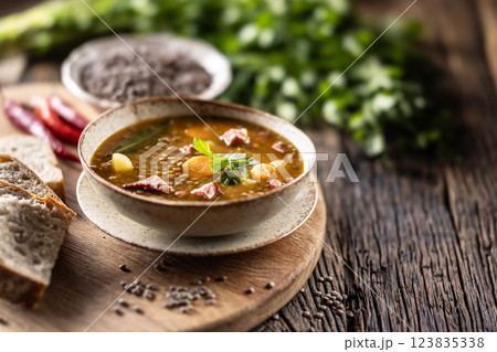 Lentil stew or soup with smoked pork meat, traditional Slovak or Czechv food Lentil stew or soup with smoked pork meat, traditional Slovak or Czechv food 123835338