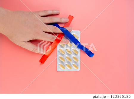 Crossed Out Pill Blister on Pink Background, Silver Medicine Package, Overdose Concept, Opioid 123836186