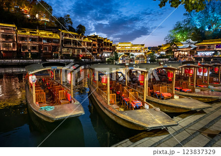 Night scene of traditional tourist boat in Fenghuang ancient city Night scene of traditional tourist boat in Fenghuang ancient city 123837329
