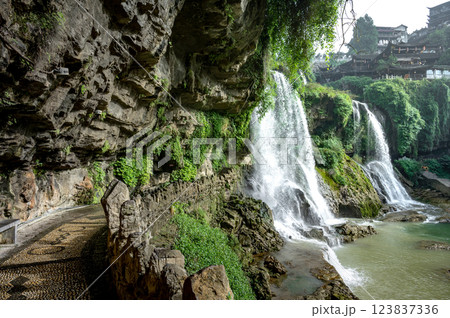 Beautiful waterfall and ancient village at Furong ancient town in Hunan, China. 123837336