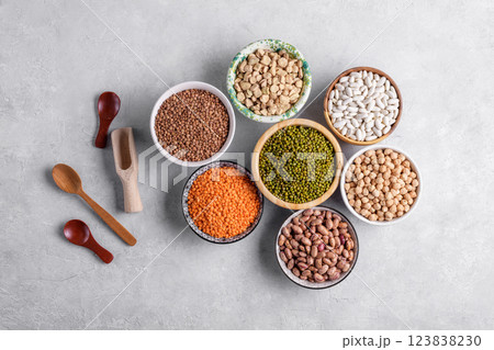 Healthy variety of dried legumes in gray background, top view Healthy variety of dried legumes in gray background, top view 123838230