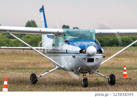 Close-up of the small private airplane with the engine running at the airfield 123838345