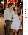Enjoying a Romantic Evening Stroll in Comfortable and Casual Attire Under the Stars 123839240