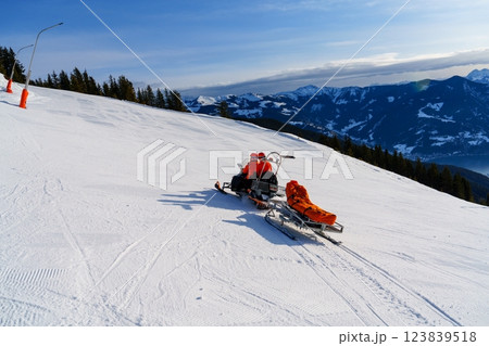 Expert Snowmobile Rescuer Navigating Challenging Mountainside Terrain for Emergency Assistance 123839518