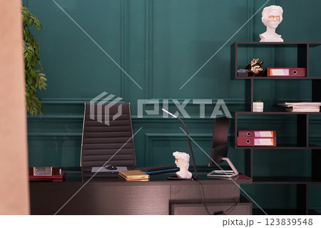 A home office with an elegant desk, ergonomic chair, minimalist decor and ample natural light creates a functional and aesthetic workspace. High quality photo A home office with an elegant desk, ergonomic chair, minimalist decor and ample natural light creates a functional and aesthetic workspace. High quality photo 123839548