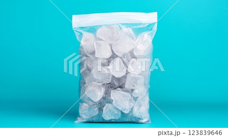 Chilled ice cubes ready for refreshing drinks in vibrant blue setting 123839646