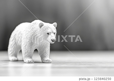 Realistic white bear figurine displayed on a wooden surface 123840250