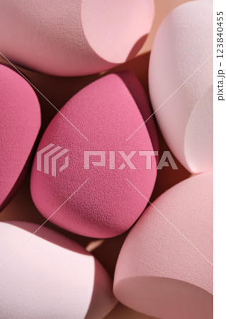 A set of makeup sponges on a pink background. 123840455