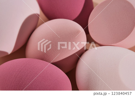 A set of makeup sponges on a pink background. 123840457